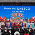 a 16:10 photo realistic image of a Chinese cultural event showing the growing influence of China since Trump withdrew