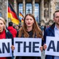 demonstrators holding signs calling for the AfD extremist political party to be banned in Germany