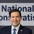 Marco Rubio speaking in front of a global national conservative alliance event
