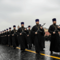 Armed, orthodox priests, marching in front of the Kremlin illustrating the role of the Russian Orthodox Church in interfering in Moldovan elections