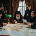 Russian orthodox priests discussing strategy over map showing the influence of the Russian Orthodox Church over Russian influence operations