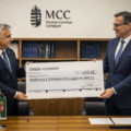 Presentation of large check donation from Victor Orban to the MCC