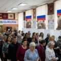 Voters lining up in polling station in Moldova showing Russian election interference