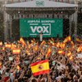 Vox rally with Spanish flags waving illustrating the growth of the global national conservative alliance in Spain