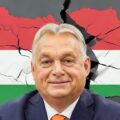Victor Orban, standing in front of a map of Hungary, showing his alliance fracturing