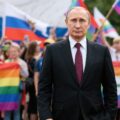 Vladimir Putin, standing in front of the LGBTQ community representing his attempt a to position Russia, as a ball work against liberal culture, and a leader in the national conservative alliance