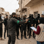 An image of Hamas intimidating, local NGO's showing their influence over information from Gaza